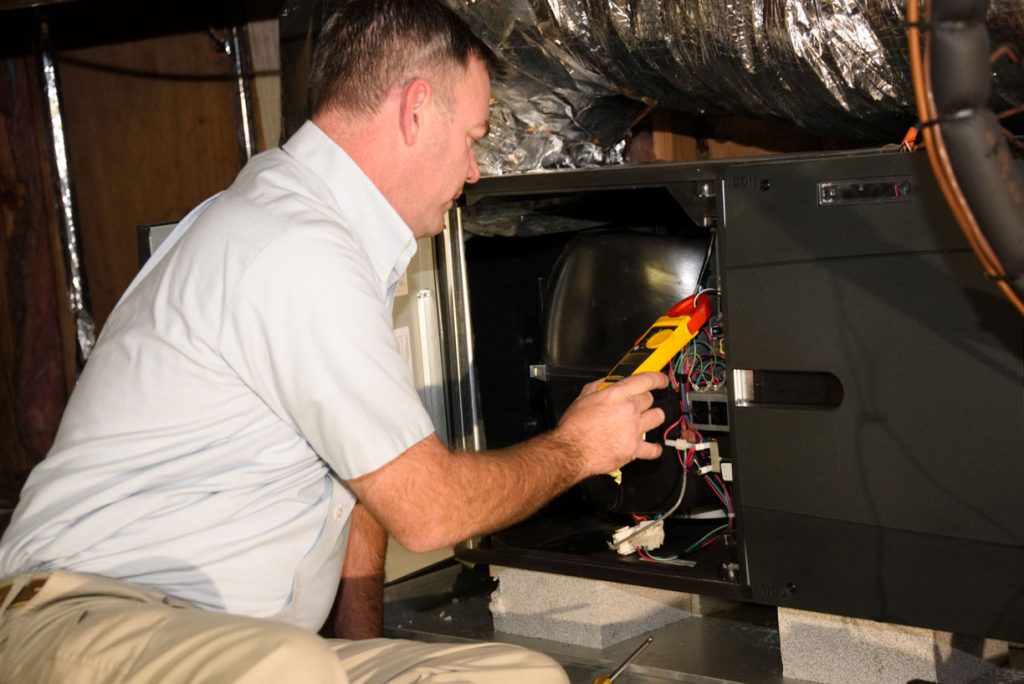 hvac-technician-repairing-heater