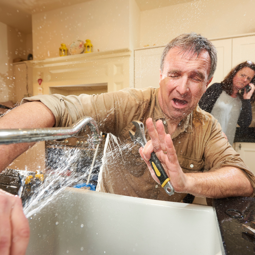 Male-Trying-DIY-Plumbing-Repair-on-Kitchen-Sink