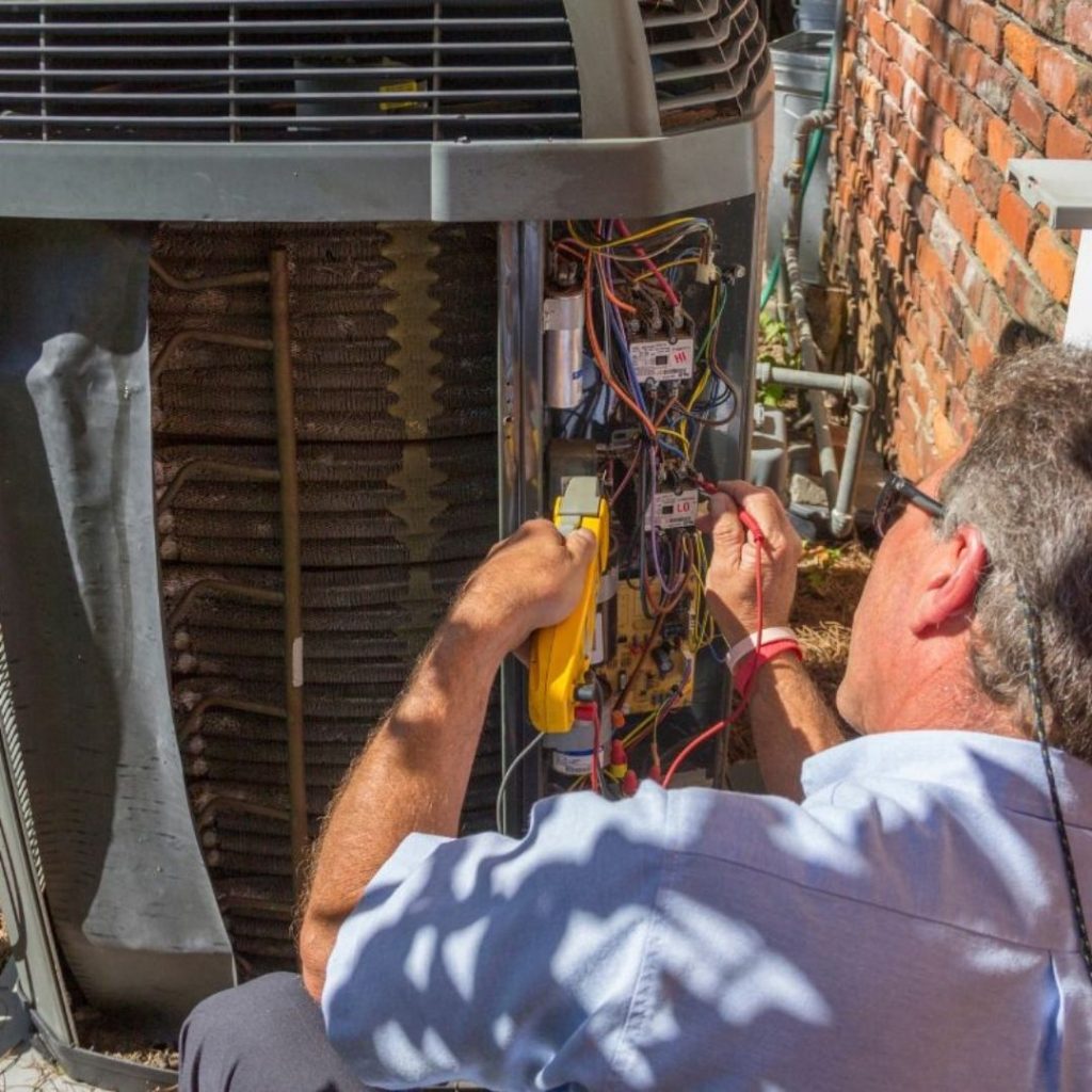 HVAC-Technician-Repairing-Heat-Pump