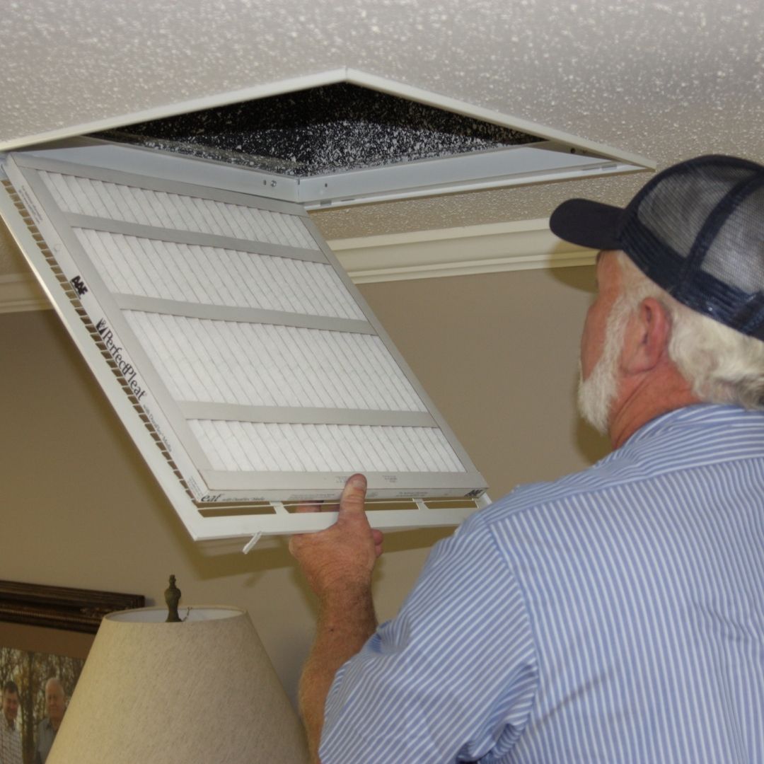Older-Male-Replacing-HVAC-Air-Filter
