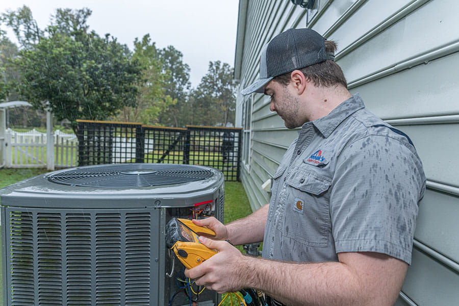 Technician performing an AC tune-up
